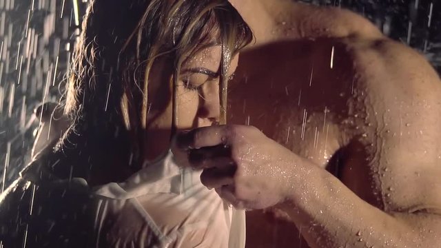 Passionate couple under the rain