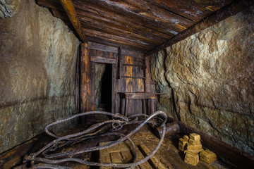 Fototapeta na wymiar Underground abandoned ore mine shaft tunnel gallery pumping room