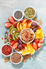 fresh seasonal fruits and superfoods on rustic background, top view vertical