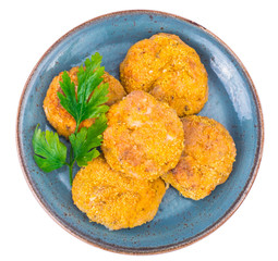 Fish cutlets on blue plate