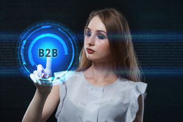 The concept of business, technology, the Internet and the network. A young entrepreneur working on a virtual screen of the future and sees the inscription: B2B