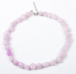 Obraz premium Necklace with stones on a white background. Bijouterie. Women's accessories. Necklace on the neck. Valuable jewelry.Decorating for women.Women's accessories isolated white background