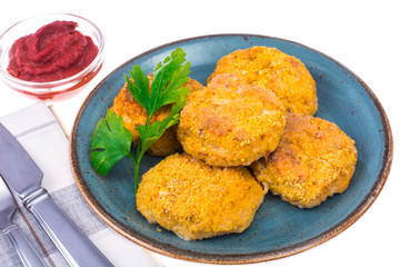 Fish cutlets on blue plate