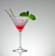 Transitional pink martini drink glass with 2 straws