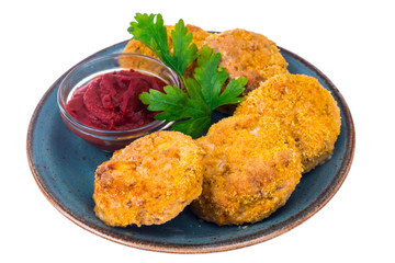 Fish cutlets on blue plate