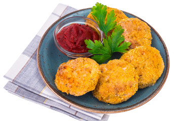 Fish cutlets on blue plate