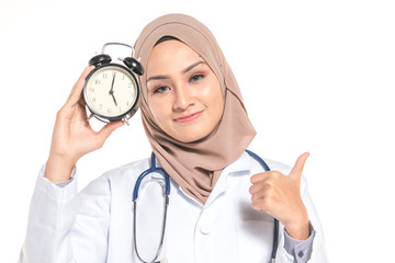 Hijab medical doctor with clock. Healthy and time management concept.