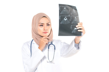 Hijab medical doctor looking at x-ray picture