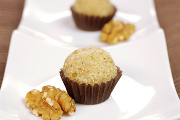 Traditional Brazilian chocolate candy called brigadeiro in walnuts gourmet version