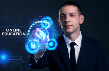 Business, Technology, Internet and network concept. Young businessman working on a virtual screen of the future and sees the inscription: Online education