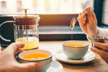 couple drink hot orange tea