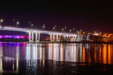 Fototapeta na wymiar Night view of illuminated bridge above of river Don in Rostov-on-Don in Russia