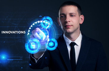 Business, Technology, Internet and network concept. Young businessman working on a virtual screen of the future and sees the inscription: Innovations