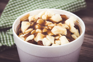 Poutine Quebec fastfood meal with french fries, cheese curd and gravy