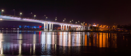 Fototapeta na wymiar Night view of illuminated bridge above of river Don in Rostov-on-Don in Russia