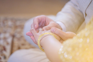 The bride and groom wear a ring Watering and relaunch Marriage is a Thai.