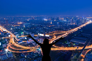 silhouette female on cityscape background