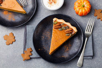 Pumpkin pie, tart with whipped cream on a plate