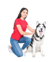 Young woman with cute Husky dog on white background. Pet adoption