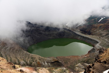 A round green hot spring lake on Zao