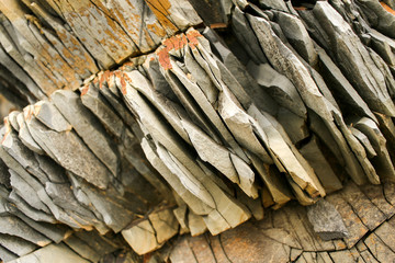 Diagonal large piece of natural layered grey mountain slate.