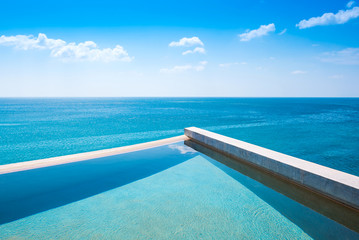 Naklejka na ściany i meble Luxurious swimming pool with beautiful sea view.