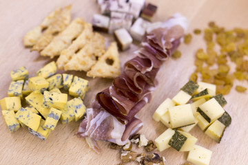 Different kinds of cheese on wood table