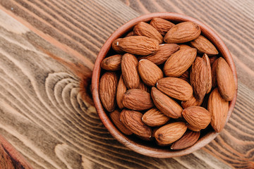 Almonds in wooden plate