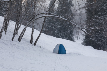 tent in the winter forest