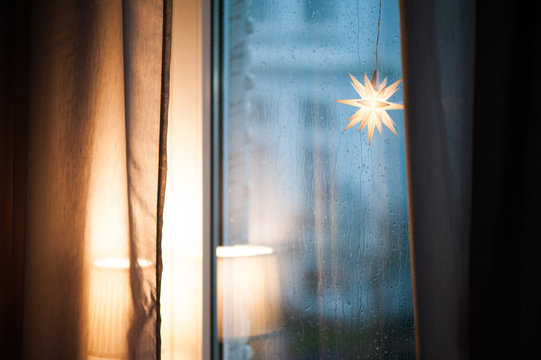 quiet scene at the rainy window. A star is shining