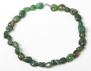 Necklace with stones on a white background. Bijouterie. Women's accessories. Necklace on the neck. Valuable jewelry.Decorating for women.Women's accessories isolated white background