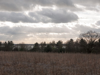 moody skyline clouds over autumn farm field