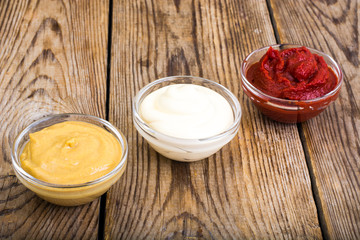 Set of three classic sauces-mayonnaise, ketchup and mustard