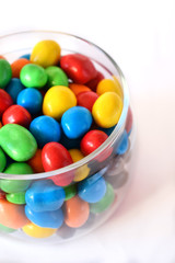 Multicoloured candies in a glass jar