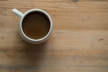 small white cup of coffee