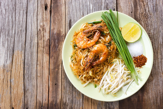 Fried noodle with prawns. Favorite Thai food. Local name, Pad Thai. Top view with copy space.