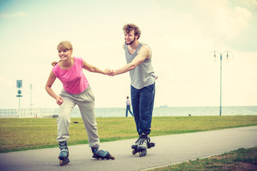 roller skater couple skating outdoor