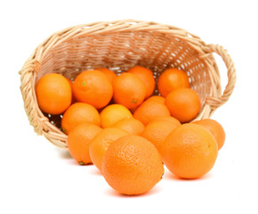 Orange mandarin or tangerine fruit isolated in basket on white background