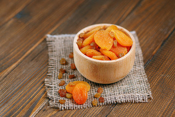 Sweet dried apricots and raisins in the bowl. The concept is healthy food, vegetarianism, diet, vitamins.