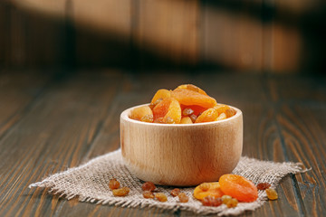 Sweet tasty dried apricots and raisins. The concept is healthy food, vegetarianism, diet, vitamins.