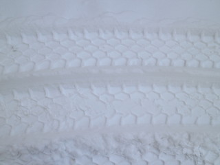 car footprints in the snow
