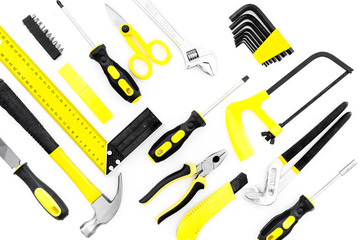 Repair tool kit. File, saw, hummer, corner ruler on white background top view pattern