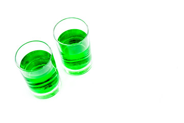 Absinthe shots on white background top view copy space