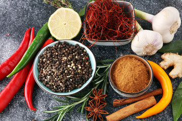 Spices and herbs on grey background. Food and cuisine ingredients.