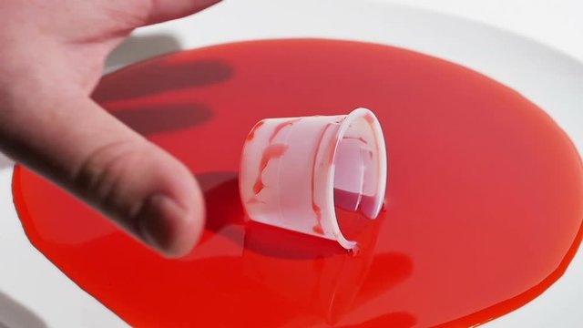Overdose on Drugs Represented by Red Medicine on Hands and Cup