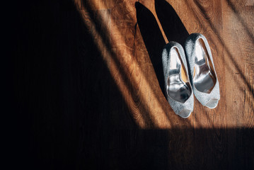 Chic silver bridal shoes in natural sunlight