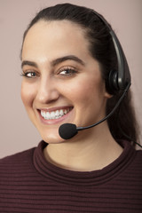 Pretty call center operator with a beaming smile..