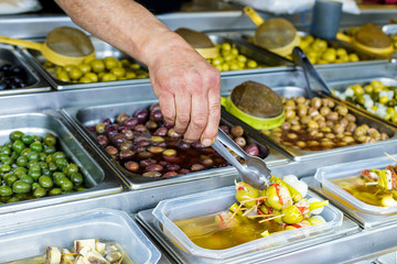 Various kinds of Olives at street Market in Spain