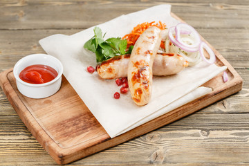 grilled sausages. Serving on a wooden Board on a rustic table. Barbecue restaurant menu, a series of photos of different meats