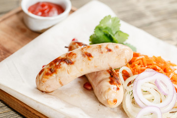 grilled sausages. Serving on a wooden Board on a rustic table. Barbecue restaurant menu, a series of photos of different meats